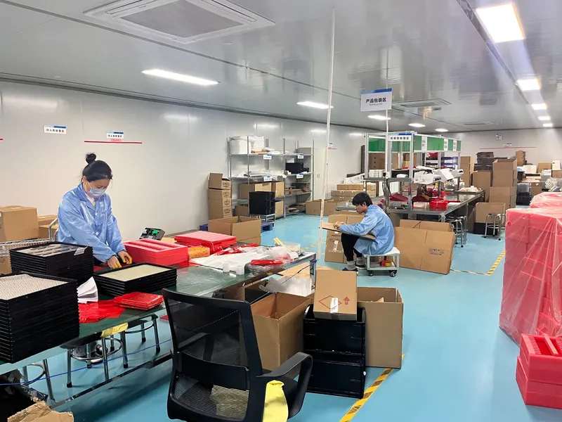 DISEA staff preparing display modules in the packing area